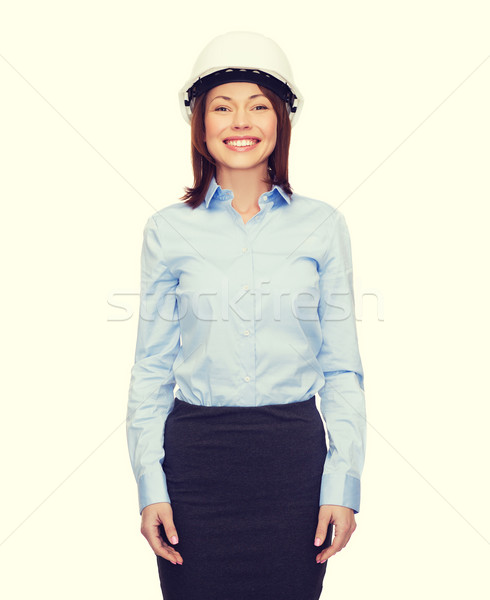 Jonge glimlachend zakenvrouw witte helm gebouw Stockfoto © dolgachov