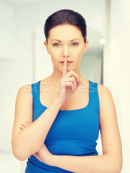 woman making a hush gesture Stock photo © dolgachov
