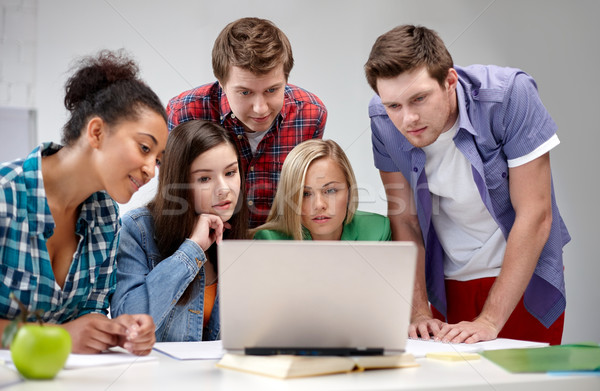 group of high school students with laptop Stock photo © dolgachov