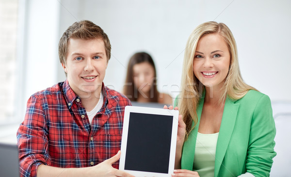 group of happy high school students with tablet pc Stock photo © dolgachov