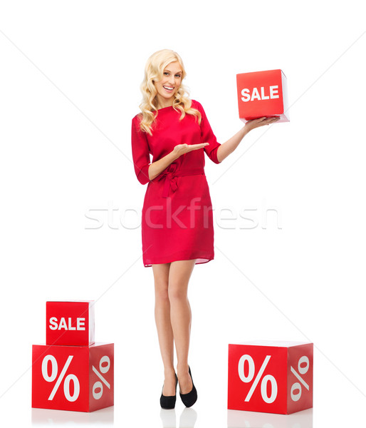 улыбающаяся женщина красное платье торговых признаков люди скидка Сток-фото © dolgachov
