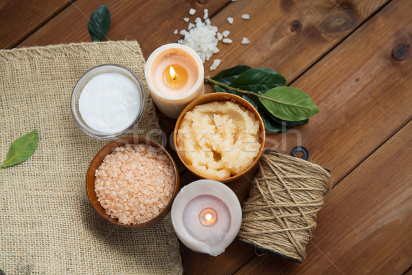 close up of natural body scrub and candles on wood Stock photo © dolgachov