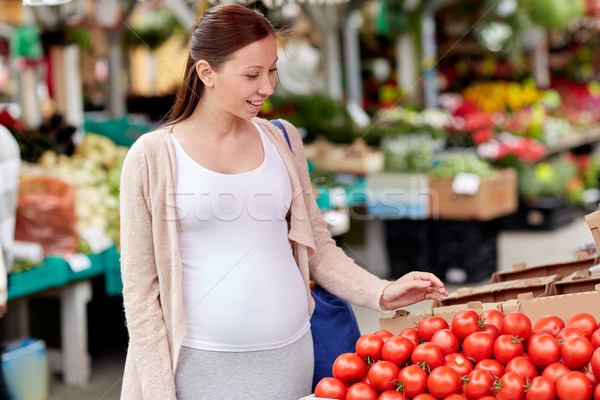 pregnant woman choosing food at street market Stock photo © dolgachov