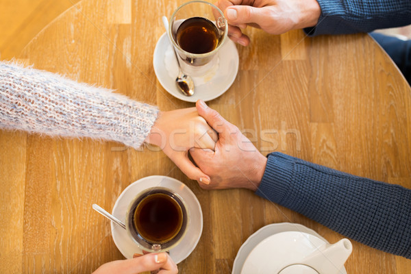 Couple mains tenant restaurant personnes amour [[stock_photo]] © dolgachov