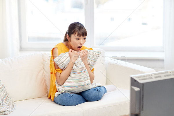 asian young woman watching tv at home Stock photo © dolgachov