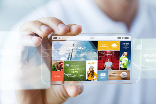 close up of male hand with news on smartphone Stock photo © dolgachov