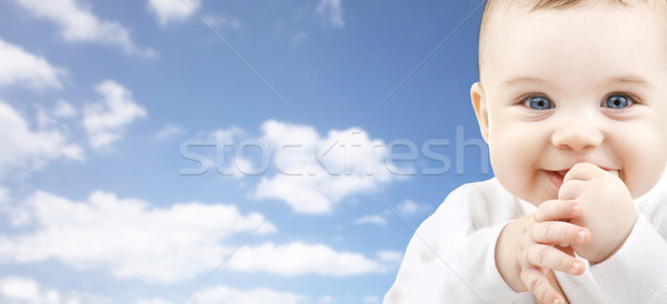 happy baby face over blue sky background Stock photo © dolgachov