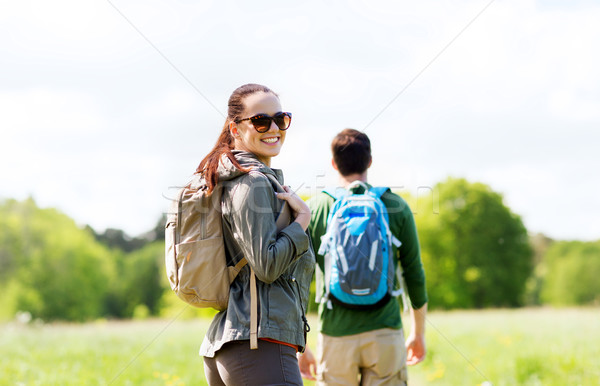 happy couple with backpacks hiking outdoors Stock photo © dolgachov