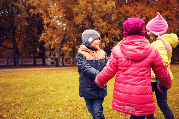 Enfants mains tenant jouer automne parc enfance [[stock_photo]] © dolgachov