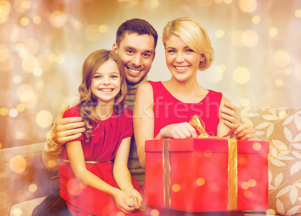 Stock photo: happy family opening gift box