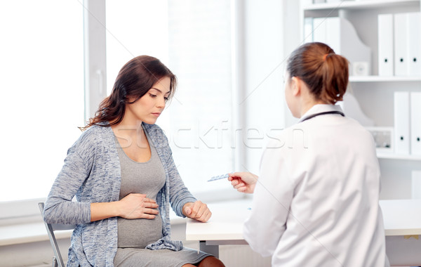 gynecologist doctor and pregnant woman at hospital Stock photo © dolgachov