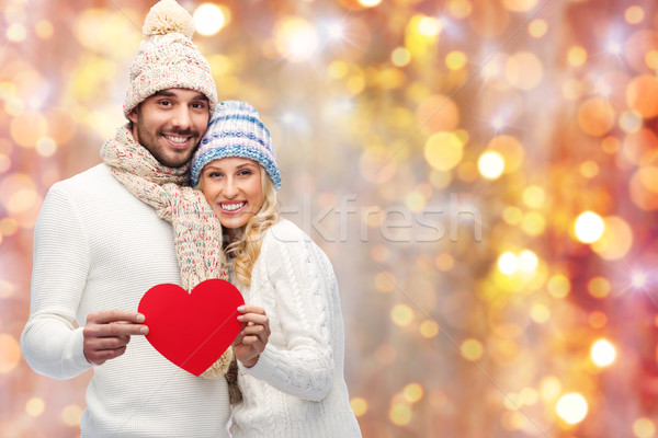 smiling couple in winter clothes with red hearts Stock photo © dolgachov