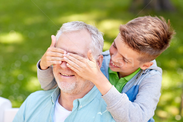 grandfather and grandson playing at summer park Stock photo © dolgachov