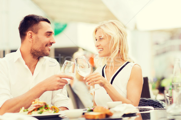 happy couple clinking glasses at restaurant lounge Stock photo © dolgachov