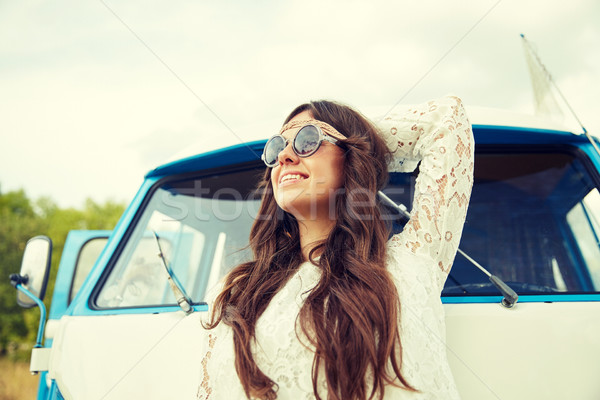 Stock photo: smiling young hippie woman in minivan car