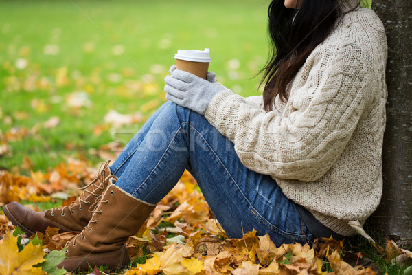 close up of woman drinking coffee in autumn park Stock photo © dolgachov