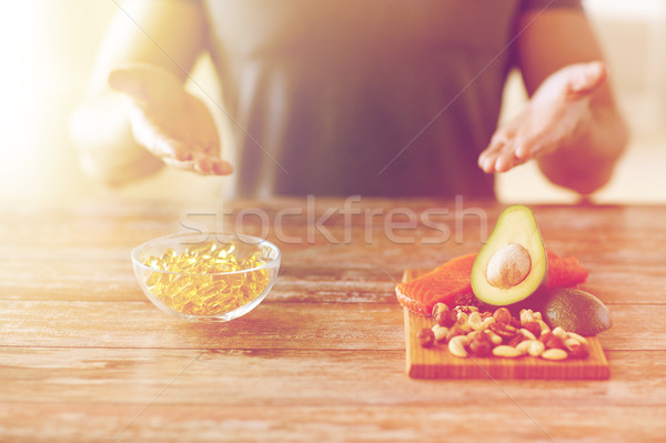 close up of male hands with food rich in protein Stock photo © dolgachov