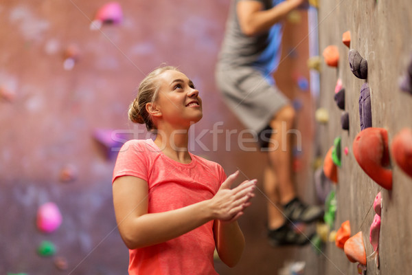 Stock photo: man and woman exercising at indoor climbing gym
