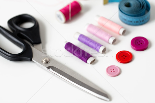 scissors, sewing buttons, threads and tape measure Stock photo © dolgachov