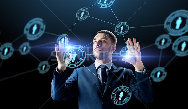 businessman with virtual network contacts Stock photo © dolgachov