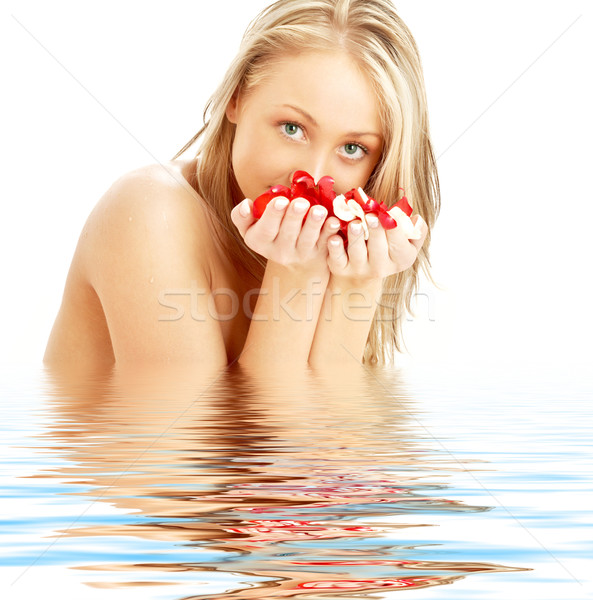 blond with red and white rose petals in water Stock photo © dolgachov