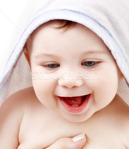 happy baby with terry hoodie robe on head Stock photo © dolgachov