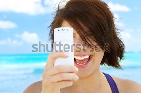 Stock photo: happy woman with cell phone