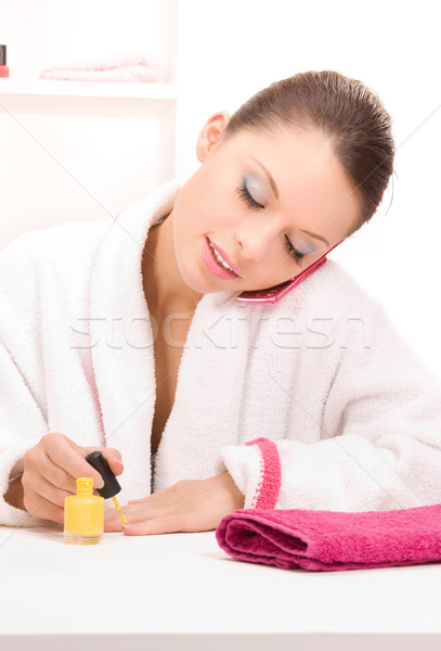 woman polishing her nails Stock photo © dolgachov