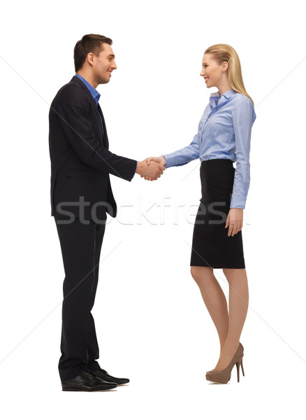 man and woman shaking their hands Stock photo © dolgachov