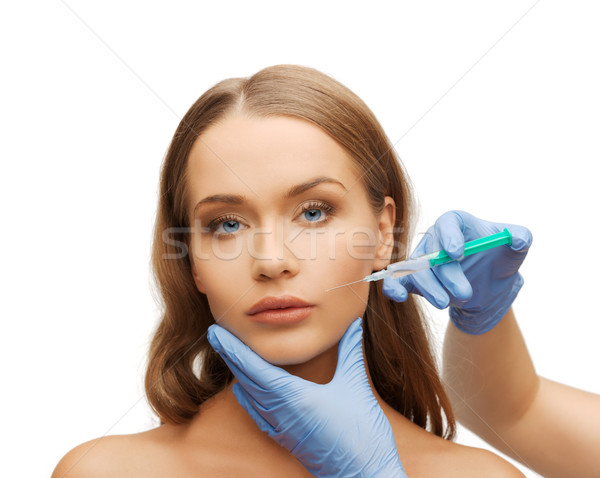 Vrouw gezicht handen spuit cosmetische chirurgie vrouw gezicht Stockfoto © dolgachov