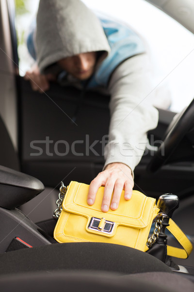 thief stealing bag from the car Stock photo © dolgachov