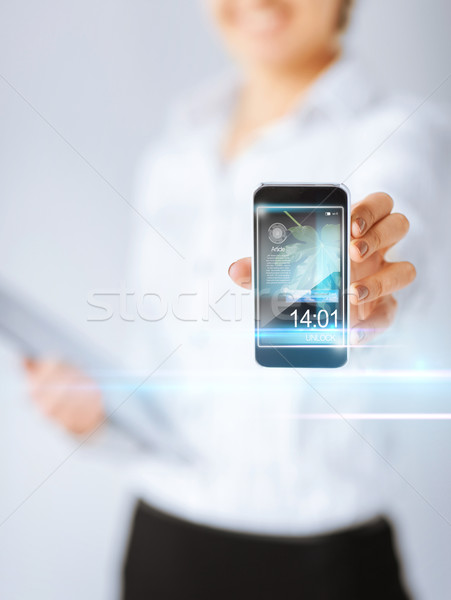 woman with smartphone and virtual screens Stock photo © dolgachov