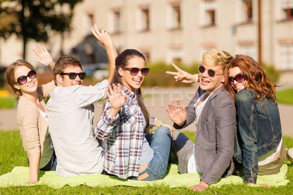 group of students or teenagers waving hands Stock photo © dolgachov