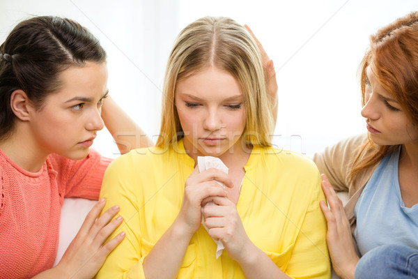 two teenage girls comforting another after breakup Stock photo © dolgachov