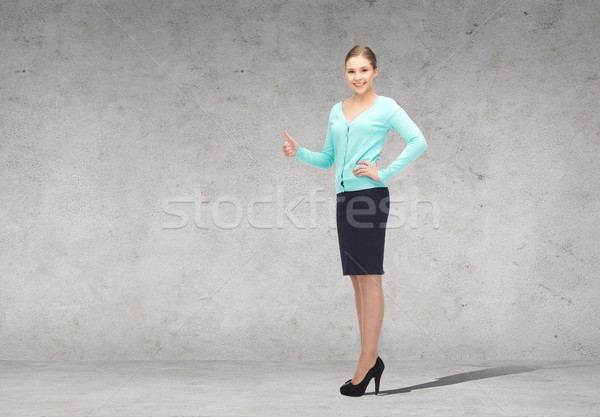 Stock photo: smiling businesswoman showing thumbs up
