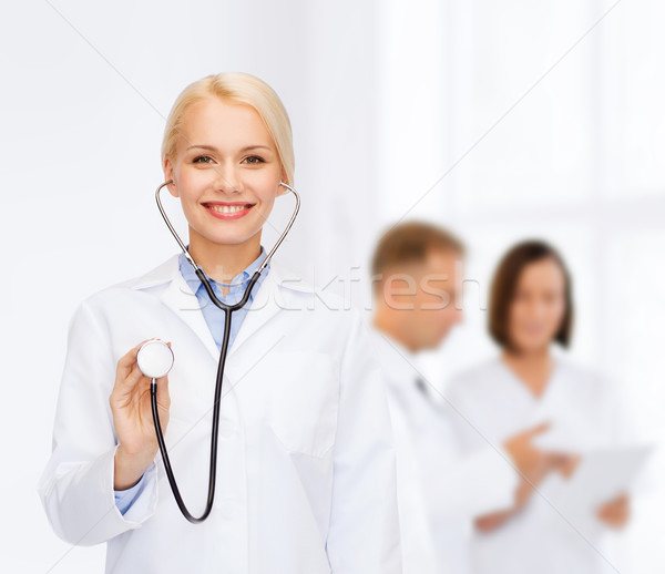 Stock photo: smiling female doctor with stethoscope