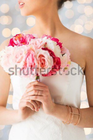 close up of happy lesbian couple with flowers Stock photo © dolgachov