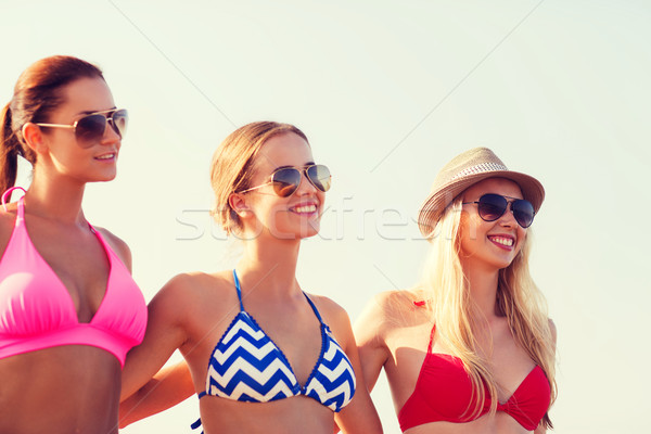 group of smiling young women in sunglasses Stock photo © dolgachov
