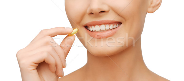 Belle femme oméga 3 vitamines santé beauté femme Photo stock © dolgachov