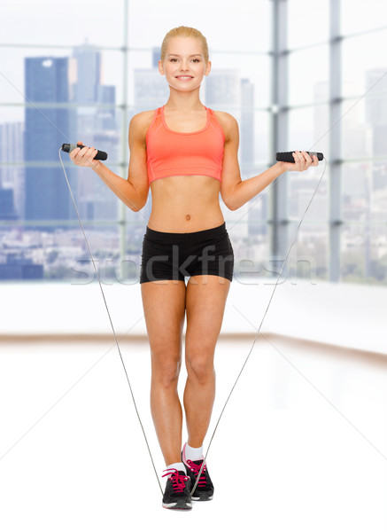 Stockfoto: Glimlachend · vrouw · springen · touw · sport