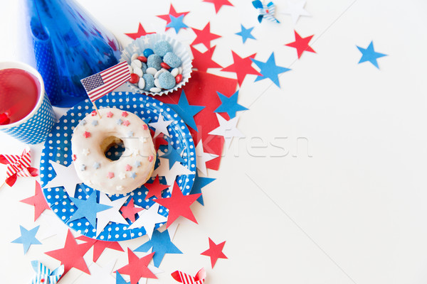 donut with juice and candies on independence day Stock photo © dolgachov