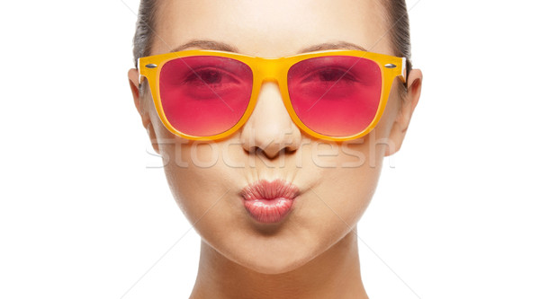 Meisje roze zonnebril kus liefde Stockfoto © dolgachov
