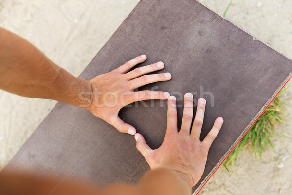 close up of man hands exercising on bench outdoors Stock photo © dolgachov