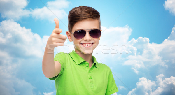 smiling boy in sunglasses and green polo t-shirt Stock photo © dolgachov