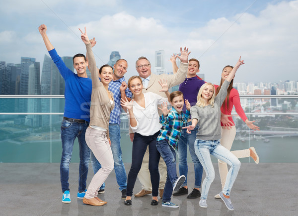 happy people having fun over city waterside Stock photo © dolgachov