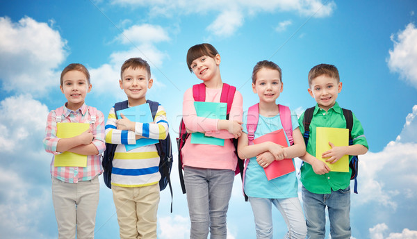 happy children with school bags and notebooks Stock photo © dolgachov