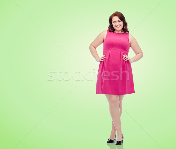 Boldog fiatal plus size nő pózol rózsaszín Stock fotó © dolgachov