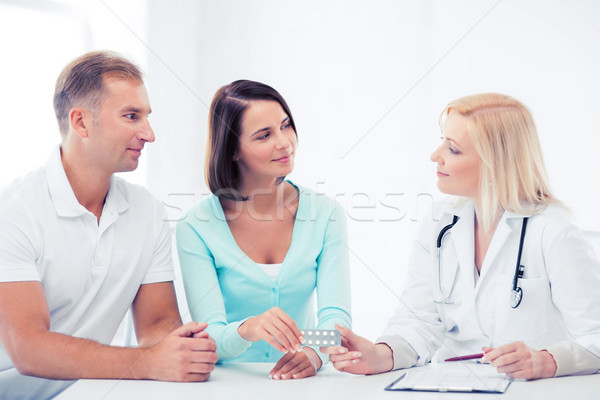 doctor giving pills to patients Stock photo © dolgachov