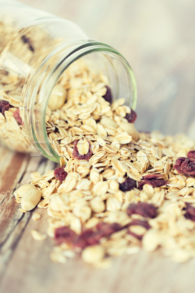 close up of jar with granola or muesli on table Stock photo © dolgachov