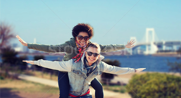 happy teenage couple in shades having fun outdoors Stock photo © dolgachov